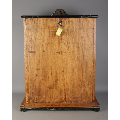 2 - An oak cased 1930's Bryan's 'Sixwin' clock penny arcade spinning game, with ebonised top panel. Stam... 