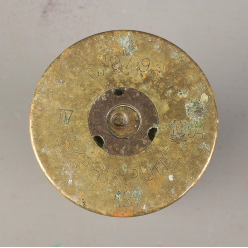 78 - A collection of brass shell cases and artillery fuses; with some fuses having discovery sites with t... 