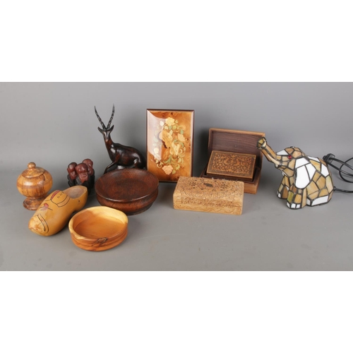 89 - A collection of woodenwares, together with a Tiffany style elephant lamp. To include carved trinket ... 