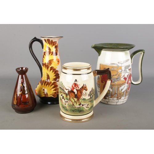 116 - A Royal Doulton tavern jug, musical hunting jug, Ivory ware Hancocks jug and a small Doulton style v... 