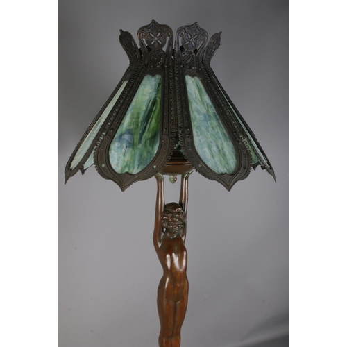 1 - An Art Deco style figural bronze table tamp with tiffany style shade; Featuring nude lady holding tu... 