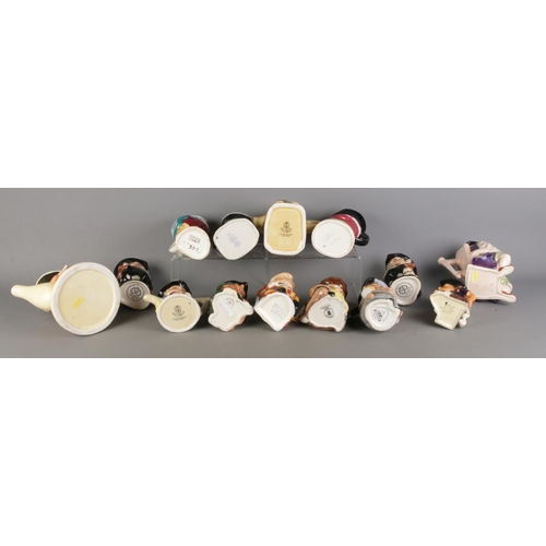 18 - Fourteen mainly Staffordshire small character jugs/teapots; Staffordshire Toby Wood Jugs and Teapots... 