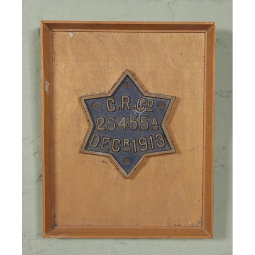 73 - A Scottish Caledonian railways star wagon registration plate 'C.R.Co 25455A Dec 1913'; mounted on a ... 