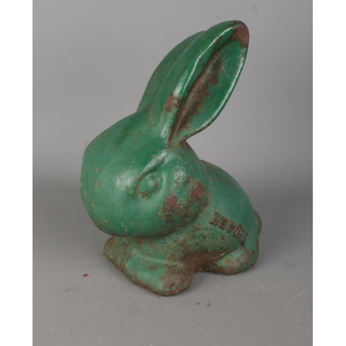 87 - A rare cast iron green painted 'Record' model of a rabbit. H18cm.