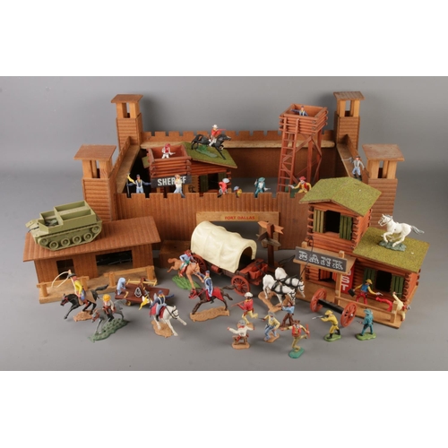 A quantity of assorted Timpo Toys and other examples alongside wooden ...