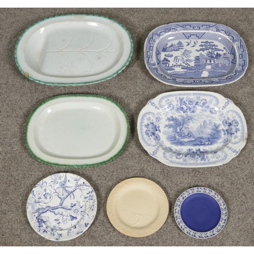 100 - A collection of antique plates and platters including a Wedgwood biscuit ware leaf plate, Old Willow... 
