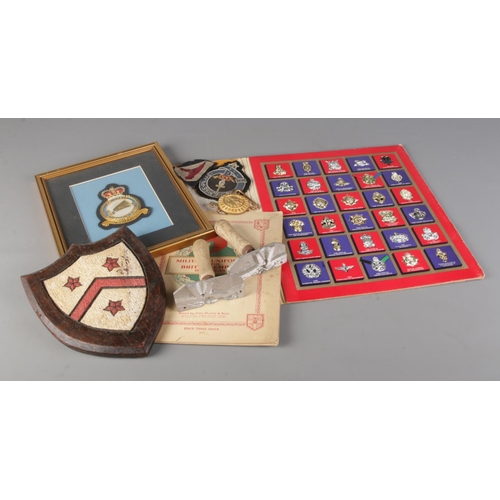 50 - A Small collection of military related items including The Great British Regiments by Texaco, Milita... 
