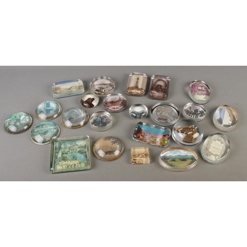 104 - A collection of twenty-three photo back clear glass paperweights; including vintage, antique and mod... 