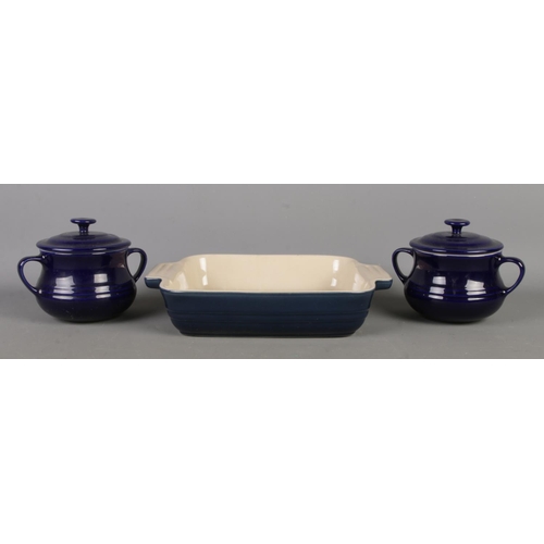 108 - Le Creuset; A Le Creuset Stoneware cobalt blue baking dish alongside two small Le Creuset Stoneware ... 