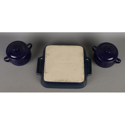 108 - Le Creuset; A Le Creuset Stoneware cobalt blue baking dish alongside two small Le Creuset Stoneware ... 