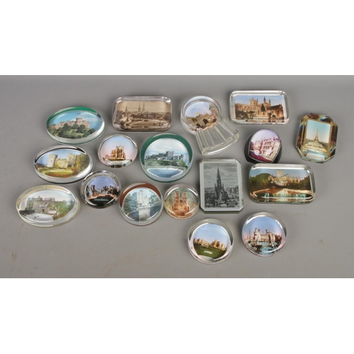 114 - A collection of souvenir paperweights with vintage and antique photos through clear glass; in variet... 