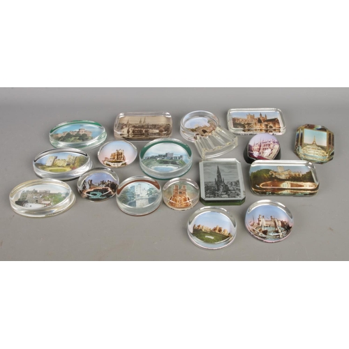 114 - A collection of souvenir paperweights with vintage and antique photos through clear glass; in variet... 