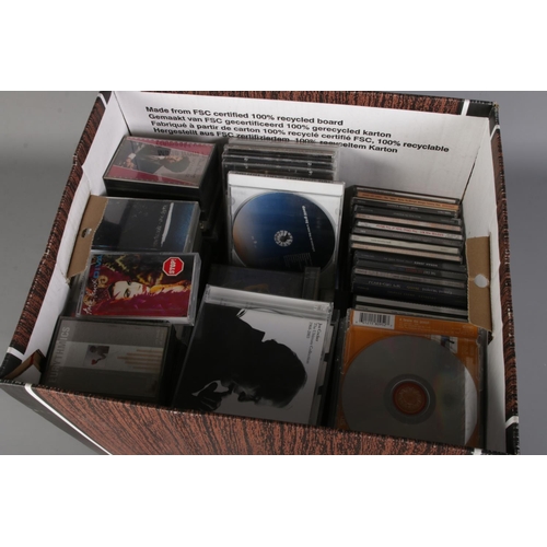 199 - A box of mixed cassette tapes and CD's inlcuding Pink Floyd, Led Zeppelin, Simply Red, Queen, Michae... 