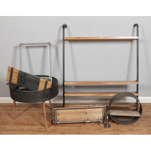 298 - A collection of vintage industrial shelving; including metal piping examples alongside an outdoor fi... 