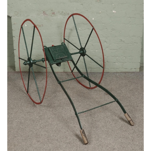 330 - Richmond & Chandler Manchester Victorian green and red painted seeder - wooden handles. L146cm.