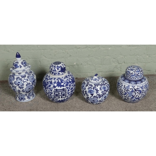 333 - Four large oriental blue and white lidded jars to include happiness jar example.