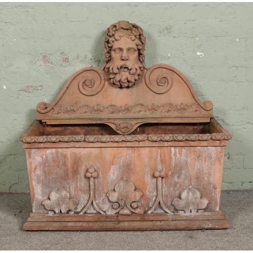 379 - A substantial terracotta planter/water feature surmounted with head of Bacchus 

Hx111cm
Wx113cm
Dx5... 