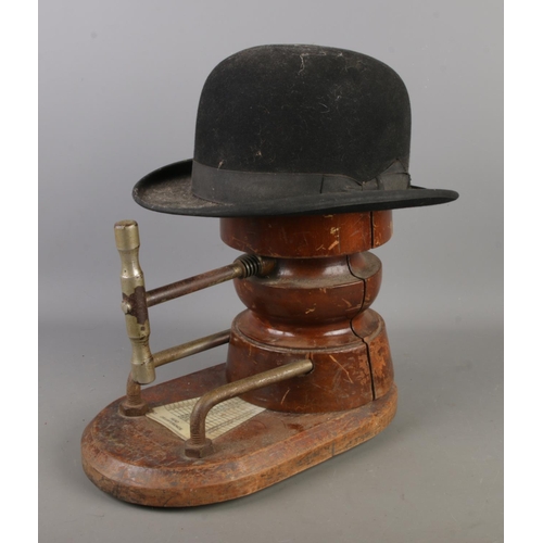 5 - An Antique Milliners Hat Stretcher with measurement plaque along with a felt bowler hat.