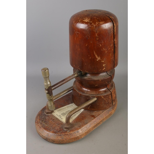 5 - An Antique Milliners Hat Stretcher with measurement plaque along with a felt bowler hat.