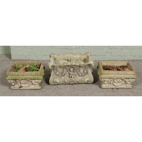 385 - A matching pair of small garden planters with a similar larger example 

Pair
Hx19cm
Wx31cm
Dx26cm