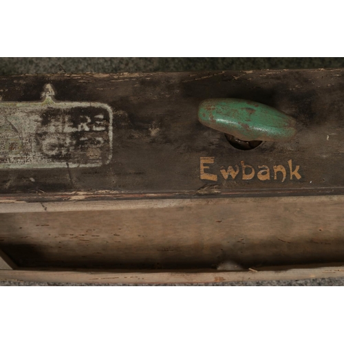 395 - A vintage Ewbank cast and wooden mangle. L65cm.