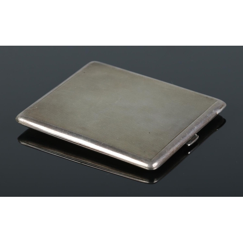 464 - A George VI silver cigarette case, with engine turned detailing. Assayed for Birmingham, 1945, by Ch... 