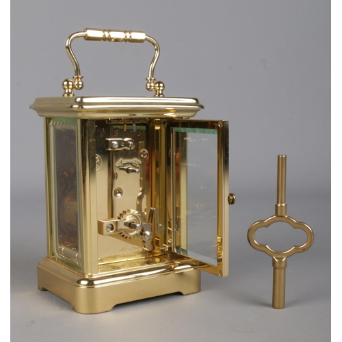 3 - A Twentieth Century French L'Epee brass carriage clock, with visible escapement and 11 jewel movemen... 