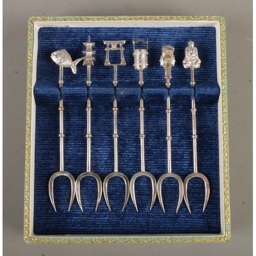 469 - A set of six Sterling silver Oriental themed cocktail forks, including Pagoda, fish and cart with ar... 