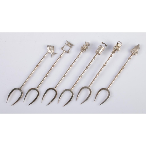 469 - A set of six Sterling silver Oriental themed cocktail forks, including Pagoda, fish and cart with ar... 