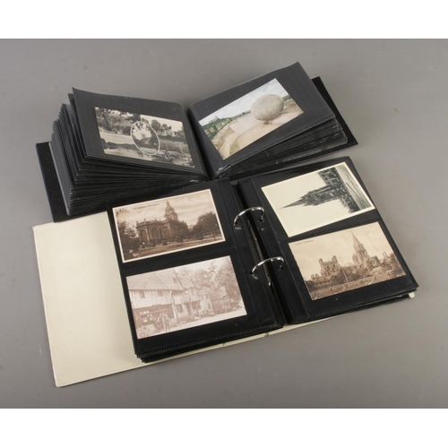 73 - Two postcard albums containing vintage and antique postcards depciting Churches, Flowers, Holiday de... 