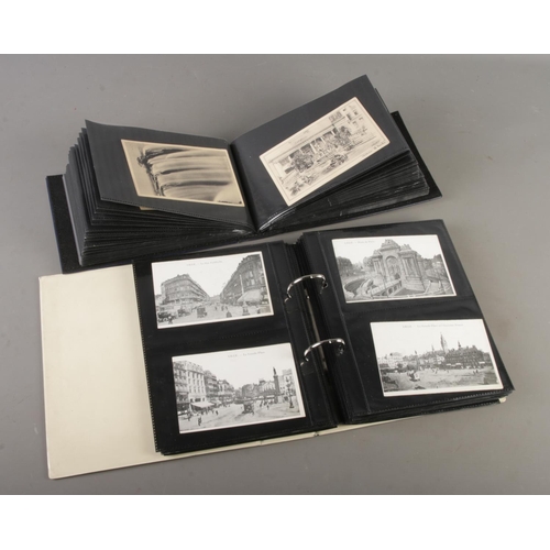 73 - Two postcard albums containing vintage and antique postcards depciting Churches, Flowers, Holiday de... 