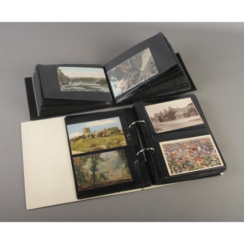 73 - Two postcard albums containing vintage and antique postcards depciting Churches, Flowers, Holiday de... 