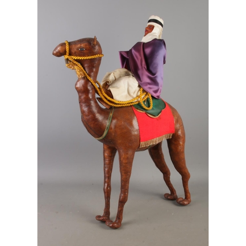 74 - A large white Italian ceramic model of an elephant, together with a leather wrapped model of a camel... 