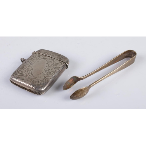 486 - An Edwardian silver vesta, with engraved floral detailing, together with a pair of George V silver s... 
