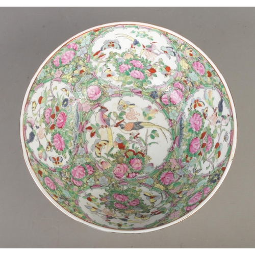 488 - A large Chinese famille rose bowl, depicting birds, butterflies and foliage, with gilt rim. Bearing ... 