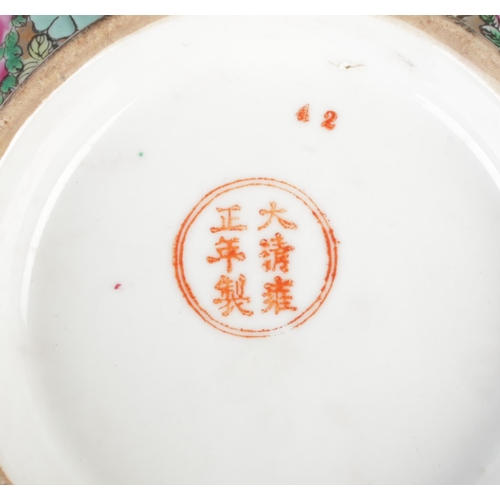 488 - A large Chinese famille rose bowl, depicting birds, butterflies and foliage, with gilt rim. Bearing ... 