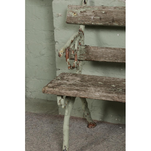 545 - A painted cast iron garden bench with branch-style frame and arms. L153cm.