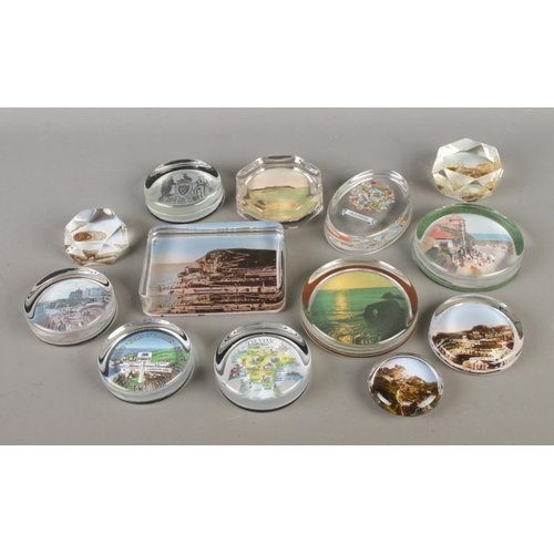 99 - Thirteen antique and vintage photo and souvenir back clear glass paperweights of seaside's; Includin... 