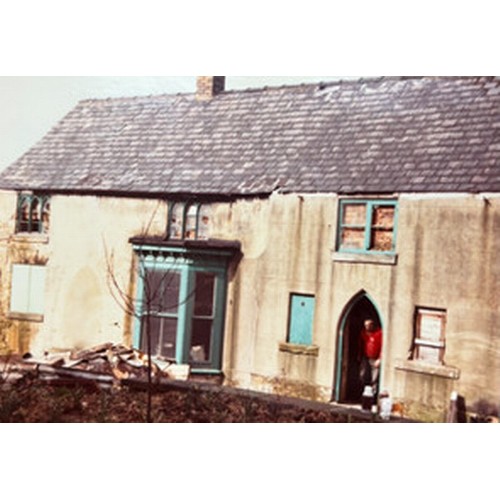 499 - An antique pine Gothic arched door featuring ironmongery studs and detailing with handles, locks etc... 