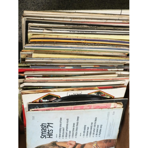 123 - Two boxes of assorted vinyl LP records of mainly pop and easy listening to include Jean Michael Jarr... 