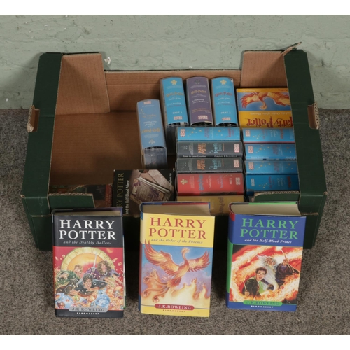 137 - A collection of J.K. Rowling's Harry Potter related items; Three first edition books examples - The ... 