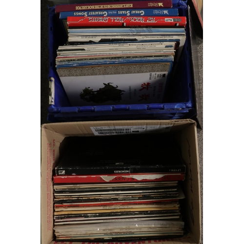 150 - Four boxes of assorted vinyl LP records of mainly pop and easy listening to include Status Quo, Kiss... 