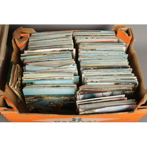 158 - A large collection of vintage postcards including a variety of locations, monuments etc alongside a ... 