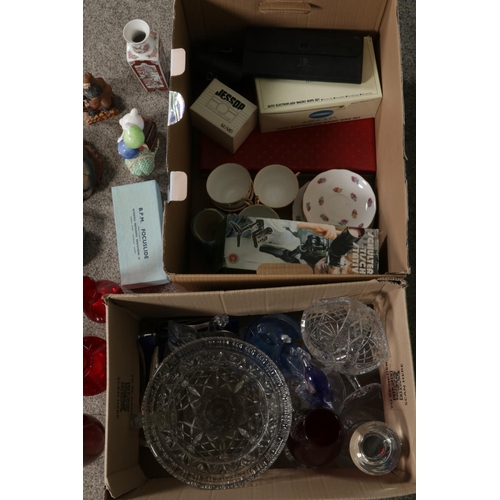 160 - Two boxes of miscellaneous to include assorted glassware, Sony Walkman players, Harry Potter figures... 