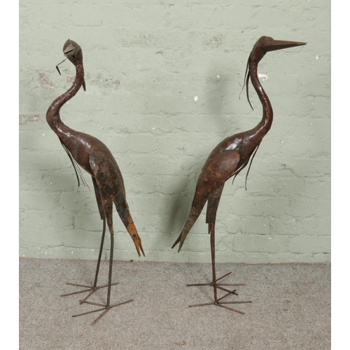 168 - A pair of garden sculptures in the form of herons, handmade using reclaimed oil drums. H100cm.