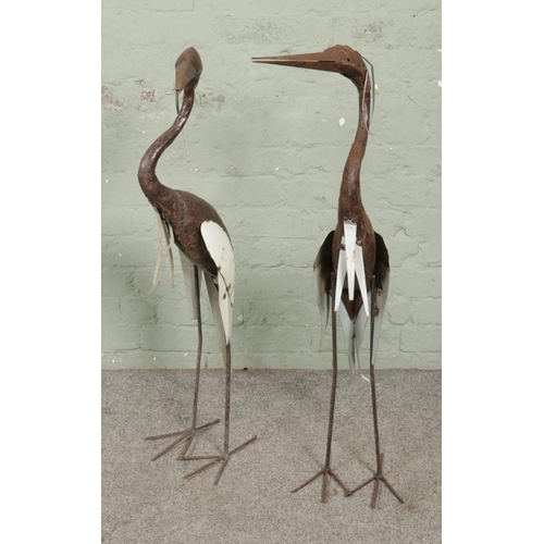 169 - A pair of garden sculptures in the form of herons, handmade using reclaimed oil drums - with white p... 