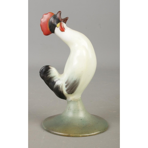 A Royal Doulton ceramic figure of a crowing Cockerel. Marked to base 'HN111 F'. Approx. height 8cm.