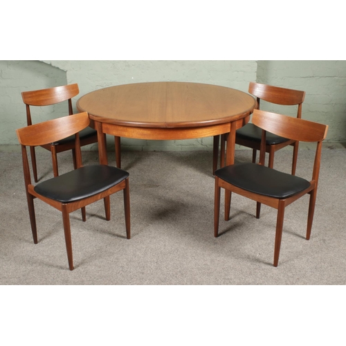 A mid-century G-Plan 'Fresco' circular extending dining table, with four G-Plan dining chairs. Dimensions of table (not extended): Height: 73cm, Diameter: 122cm.