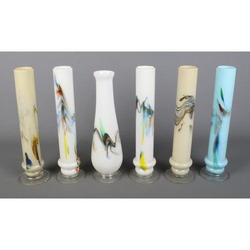 Six tall art glass specimen vases in various colourways.