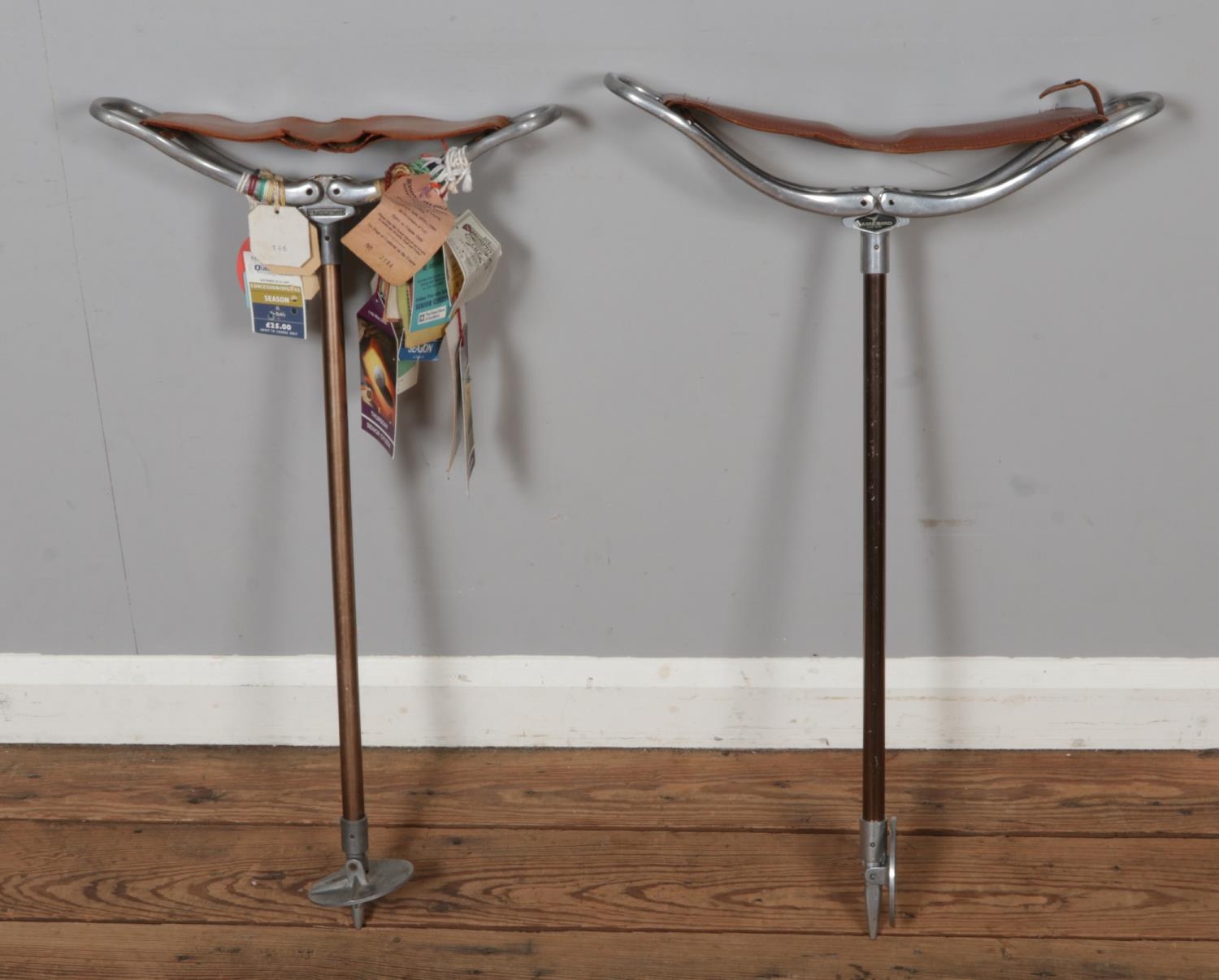 Two vintage shooting sticks including a 'Gamebird' example with leather ...